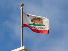 California flag on a flag pole in blue sky