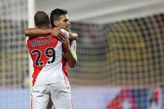 Monaco's Colombian forward Radamel Falcao (back) celebrates with French forward Kylian Mbappe after scoring a goal during the French L1 football match between AS Monaco and Montpellier at the Louis II Stadium in Monaco on October 21, 2016.