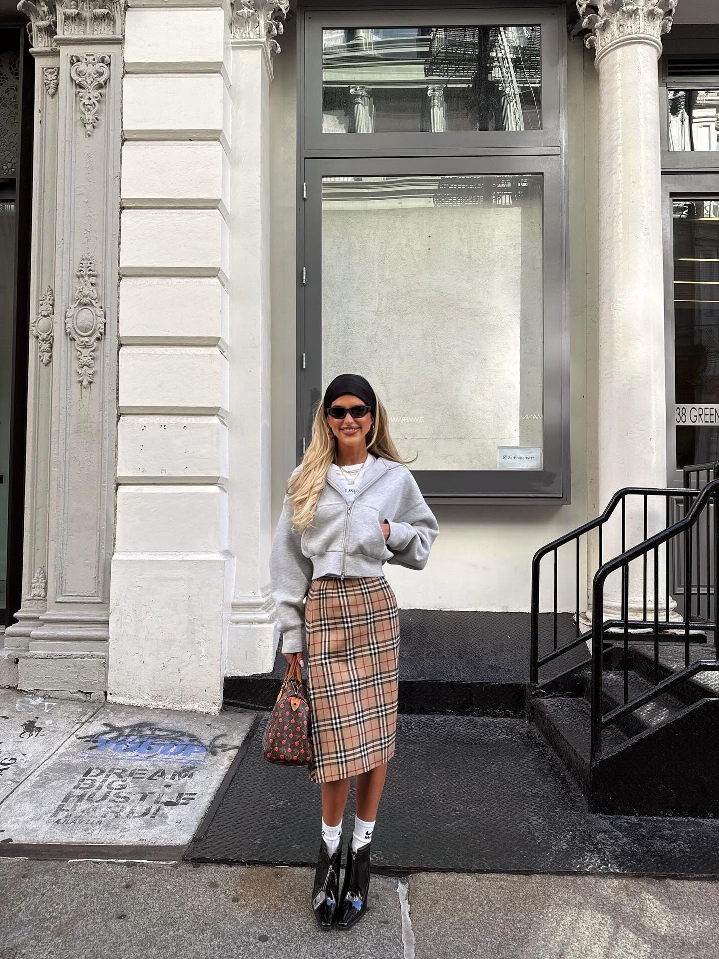 Emili Sindlev wearing a Burberry plaid skirt