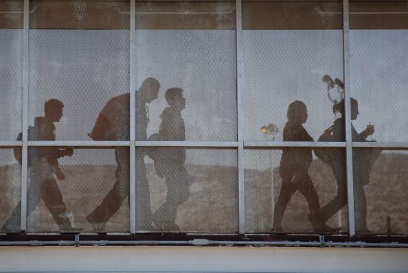 A group of immigrants deported from the U.S. walk into Tijuana, Mexico.