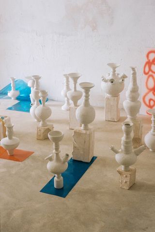 ceramic sculptures on white floor