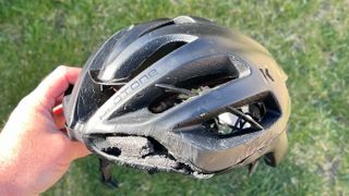 The Kask Protone helmet showing crash damage