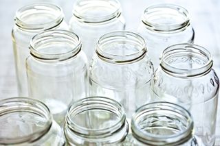 Empty jam jars on a shelf