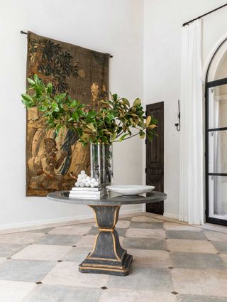 a modern entryway with hanging wall art