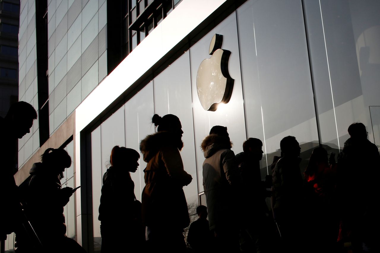 People line up at an Apple store in Beijing.