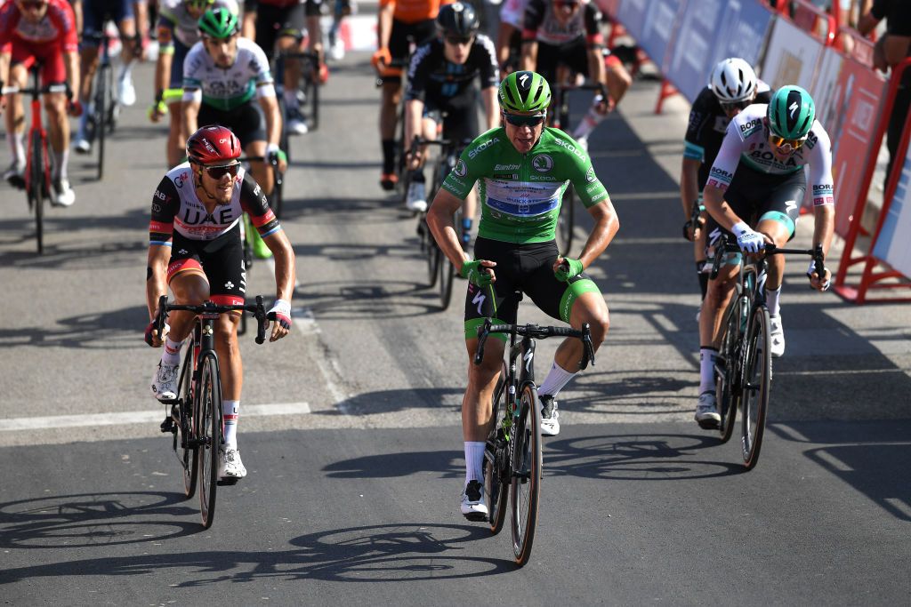 SANTA CRUZ DE BEZANA SPAIN AUGUST 31 Fabio Jakobsen of Netherlands and Team Deceuninck QuickStep Green Points Jersey celebrates at finish line as stage winner ahead of Matteo Trentin of Italy and UAE Team Emirates L during the 76th Tour of Spain 2021 Stage 16 a 180km stage from Laredo to Santa Cruz de Bezana lavuelta LaVuelta21 on August 31 2021 in Santa Cruz de Bezana Spain Photo by Tim de WaeleGetty Images