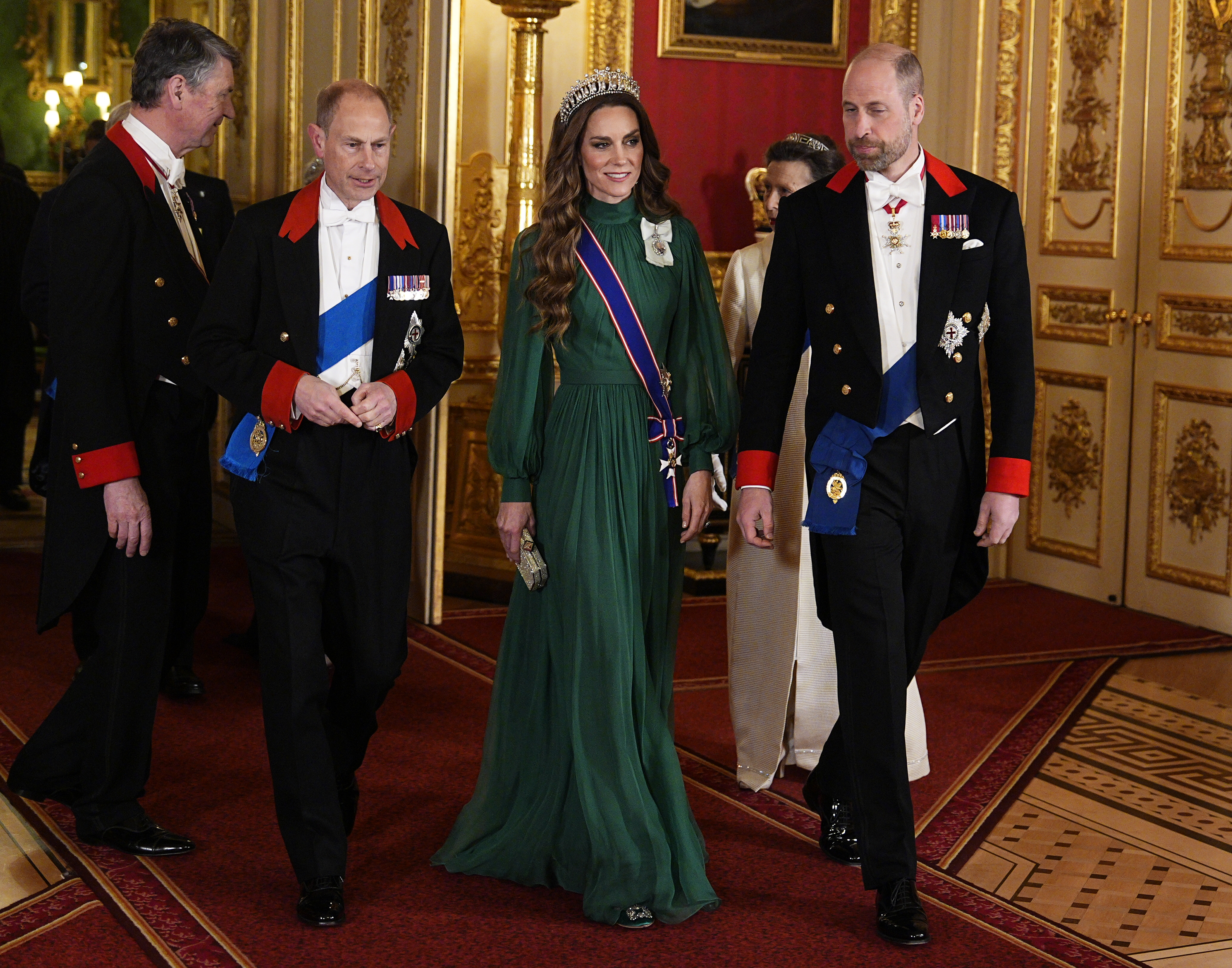 Princess Kate and Prince William walking with Prince Edward at a state banquet at Windsor Castle