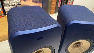 KEF LSX II speakers in blue finish close up of fabric cover on cabinet