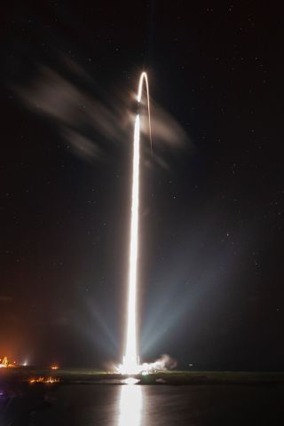 A used SpaceX Falcon 9 rocket launches the first 60 Starlink internet satellites into orbit in this long-exposure image, showing a dazzling streak into space, on May 24, 2019 from Cape Canaveral Air Force Station, Florida.