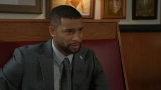 Brandon Claybon as Martin sitting in a booth in Beyond the Gates