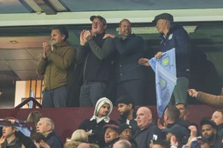 Prince William standing up cheering at an Aston Villa football match with friends Harry Aubrey-Fletcher, Edward van Cutsem and Thomas van Straubenzee