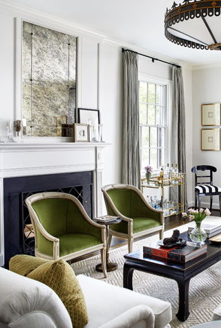 living room with deep green chairs