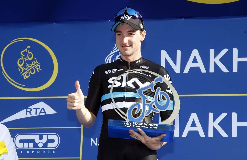 Elia Viviani accepts his winner's trophy