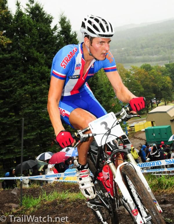 Jaroslav Kulhavy (Czech Republic) rides an uphill corner as the rain comes down