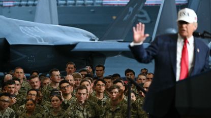 Donald Trump delivers a speech in front of US Navy personnel on board the US Navy's USS George Washington aircraft carrier at the US naval base in Yokosuka on October 28, 2025