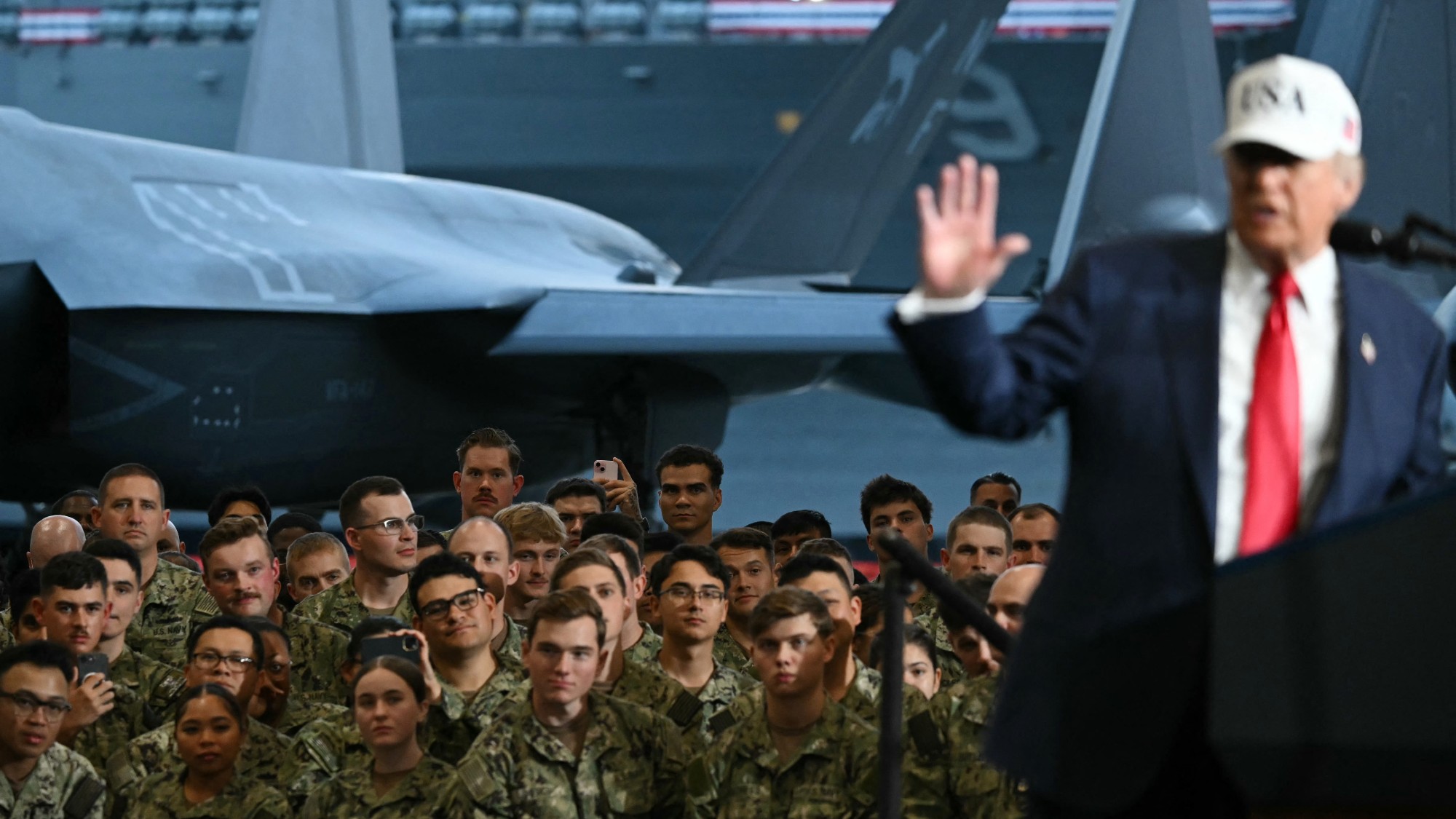 Donald Trump delivers a speech in front of US Navy personnel on board the US Navy's USS George Washington aircraft carrier at the US naval base in Yokosuka on October 28, 2025
