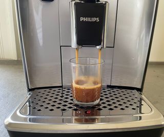 Philips 5400 Series LatteGo making an espresso in an espresso shot glass
