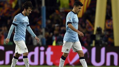 David Silva and Jesus Navas of Manchester City leaving the pitch after the match with Barcelona 