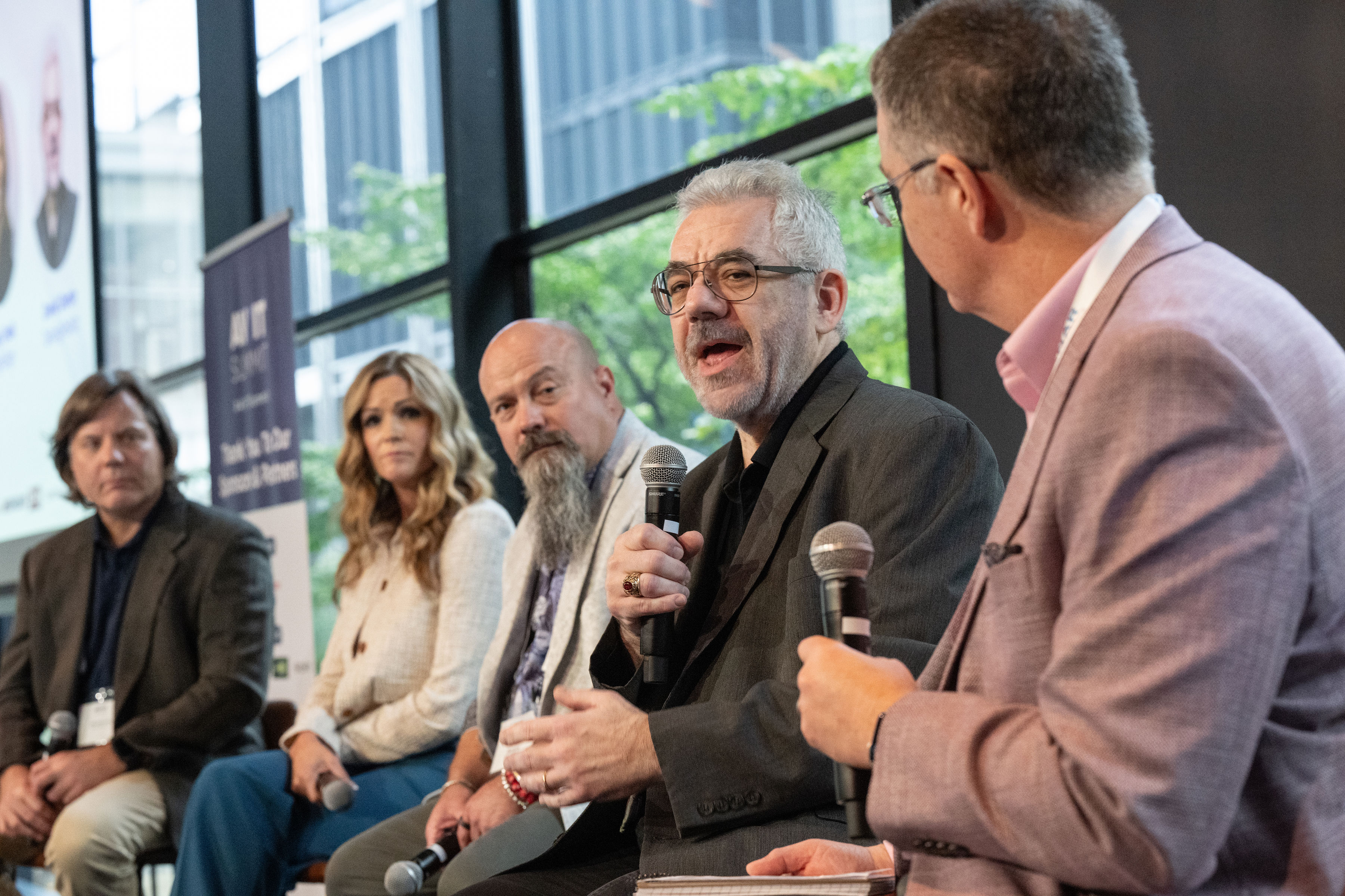 Mark J. Pescatore hosts a panel on pain points and AI at the 2025 AV/IT Summit.