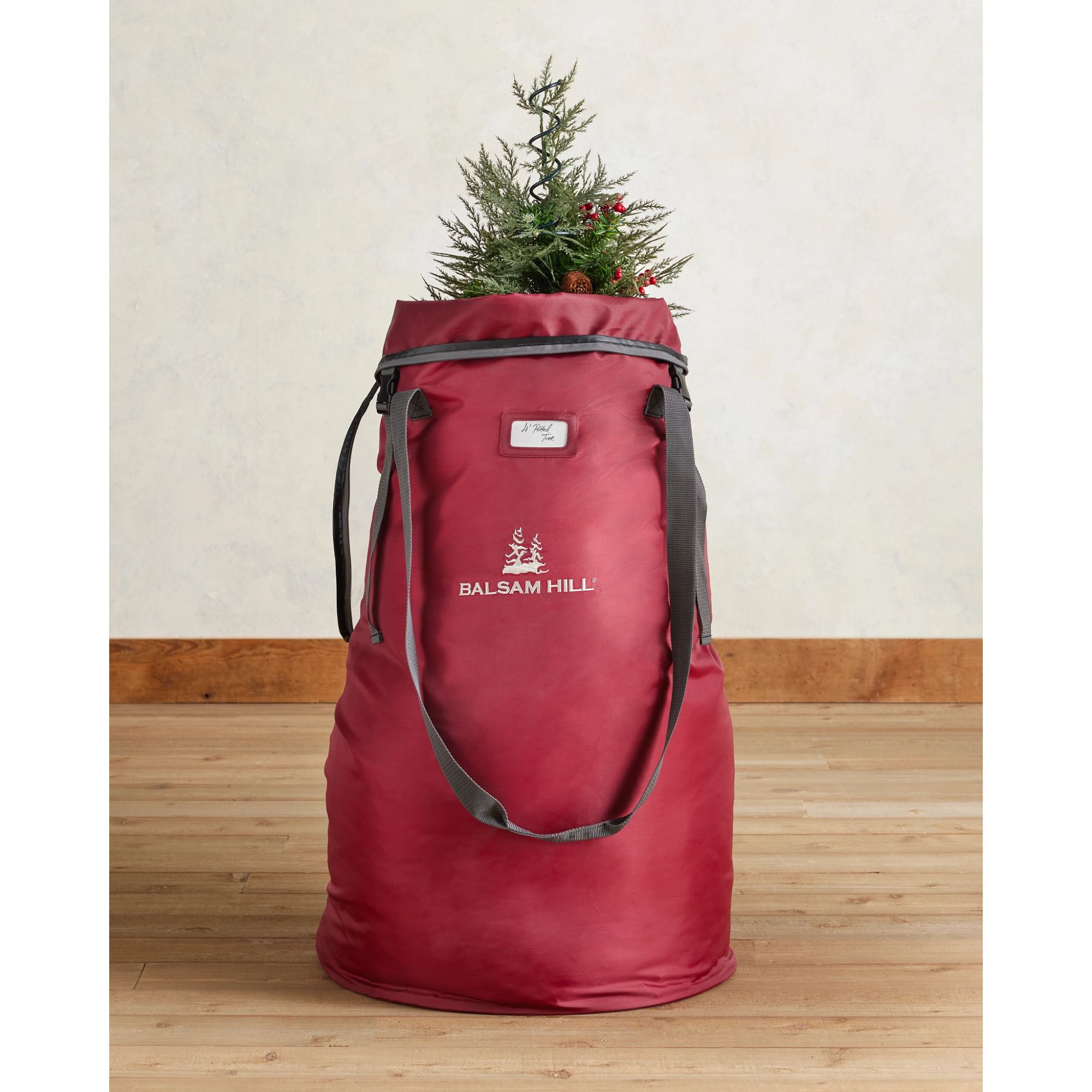 Red storage bag for a small tree