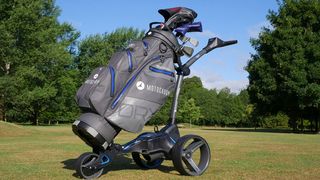 Motocaddy M5 GPS Trolley with bag attached on grass