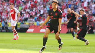 Jamal Musiala of Bayern Munich celebrates after scoring his team's second goal during the Bundesliga match between Koln and Bayern Munich at the RheinEnergie Stadion on May 27, 2023 in Cologne, Germany.