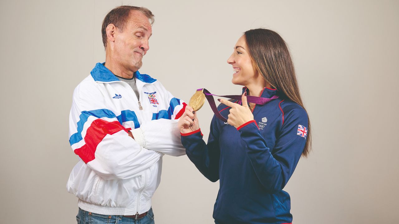 Dani Rowe and her dad Trevor King admire her gold medal