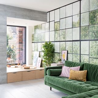 living room with french window and green coloured sofa