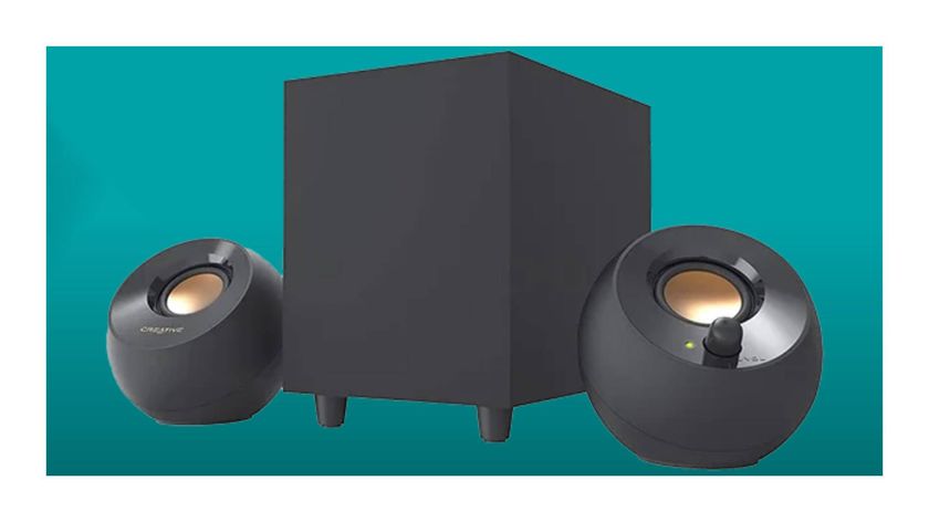 Creative Pebble Plus speakers on a teal deals background