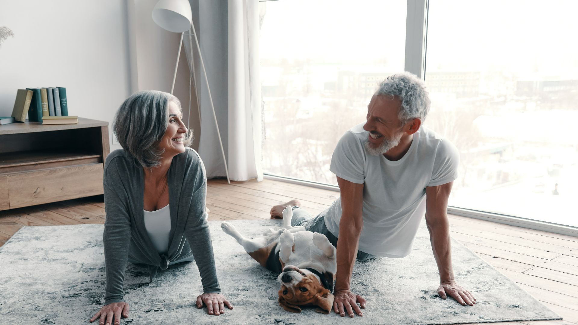 couple exercising with dog