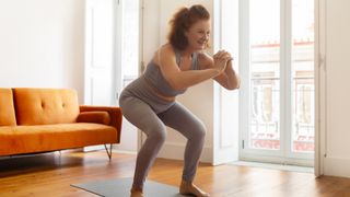 Woman performing squat move
