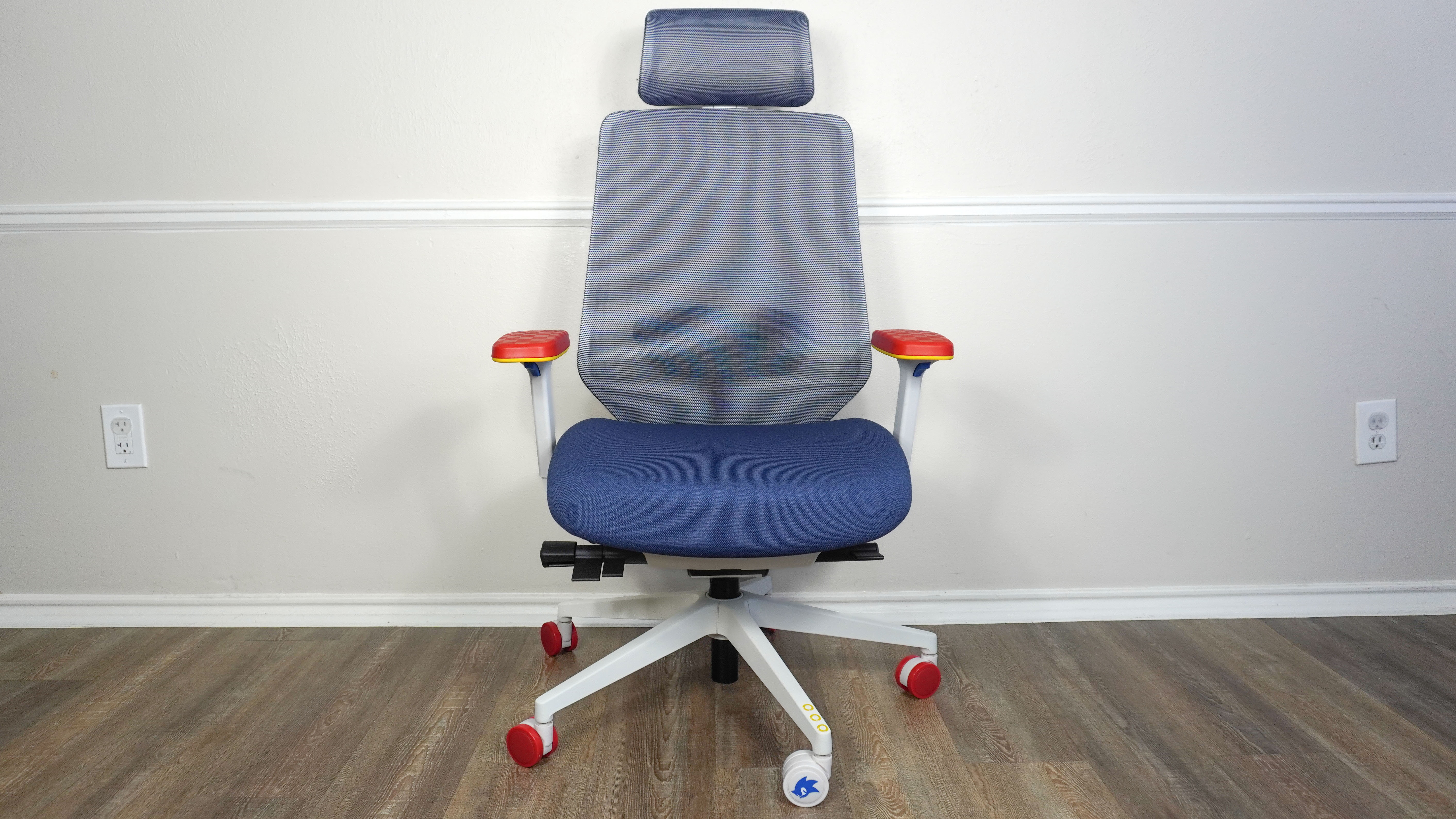 The Branch Ergonomic Chair Pro: Sonic the Hedgehog Edition up against a wall