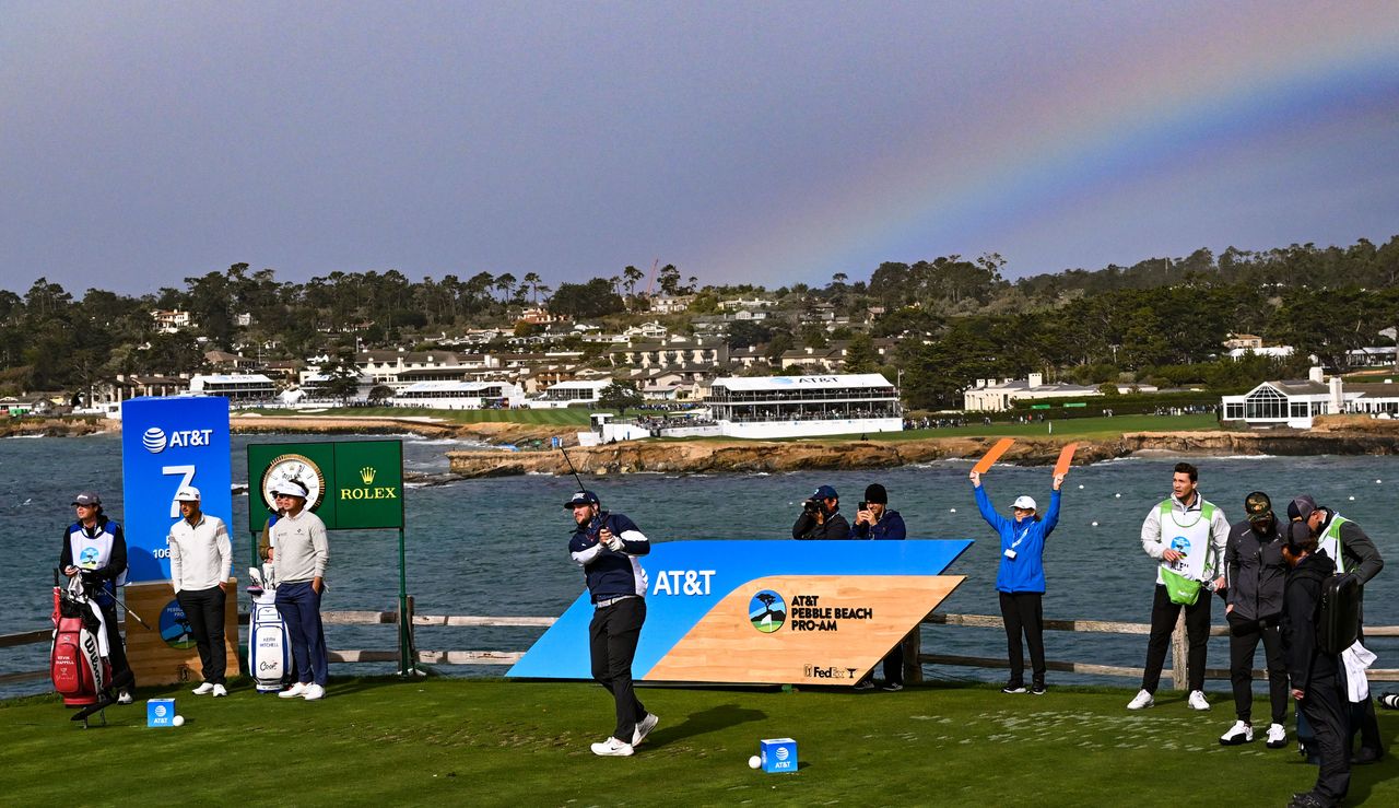 A golfer hits a tee shot on the 7th hole at Pebble Beach Golf Links