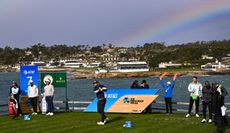 A golfer hits a tee shot on the 7th hole at Pebble Beach Golf Links
