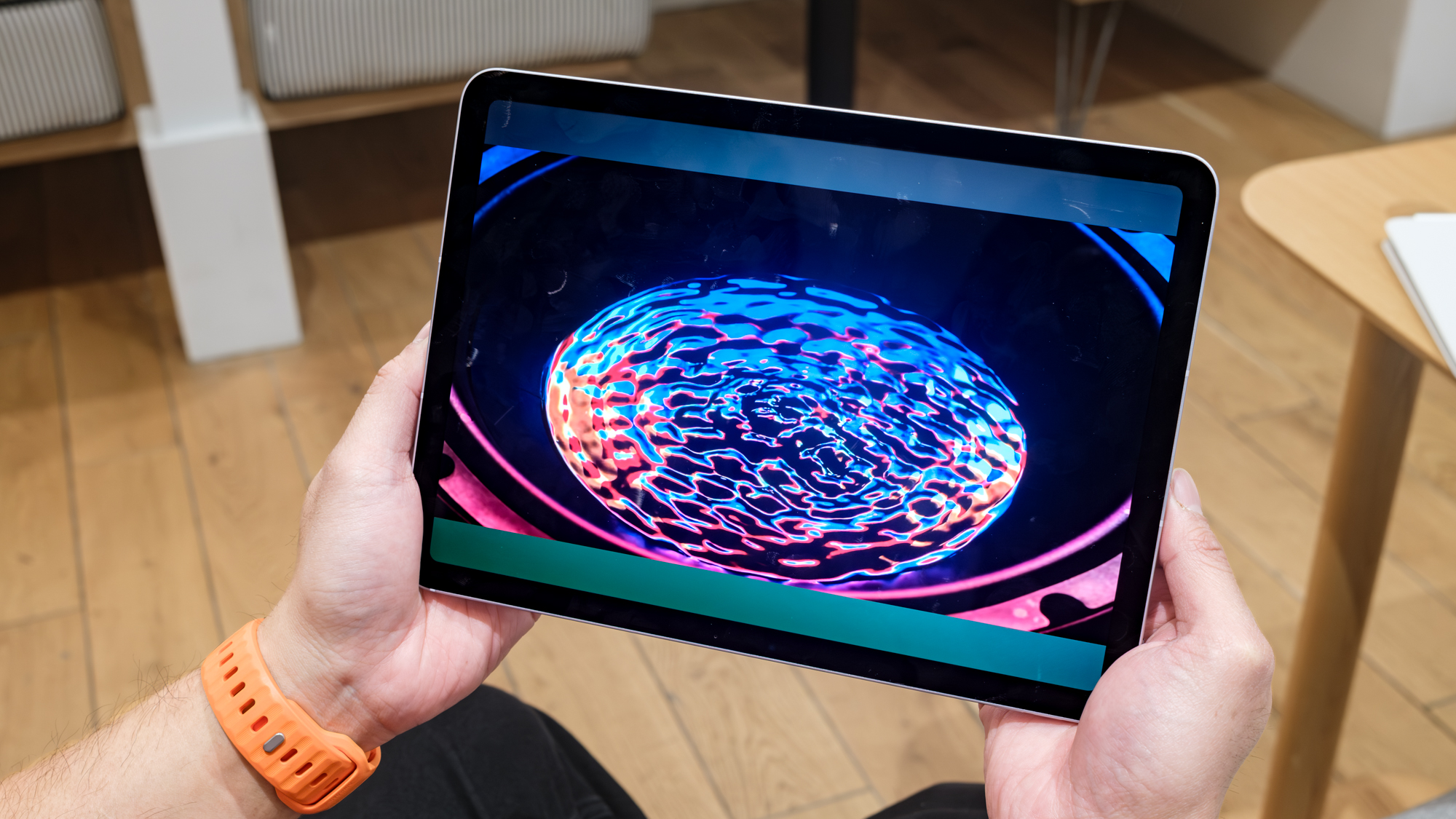 iPad Air M4 being held in landscape mode