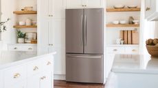 Frigidaire refrigerator in a traditional-style white and wood accented kitchen