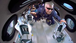 Virgin Galactic founder Richard Branson soars like Superman while in weightlessness during his Unity 22 launch on the SpaceShipTwo VSS Unity on July 11, 2021.