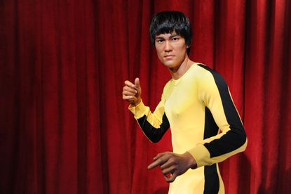 A wax figure of Bruce Lee.