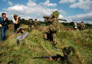 ’Photo-opportunity during Territorial Army exercise’ from The Pleasure Principle, by Chris Steele-Perkins, 1989