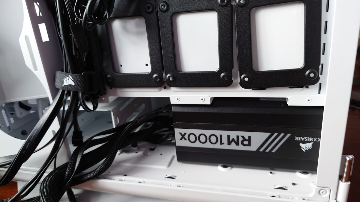 Installing the PSU into our case with the cables routed through