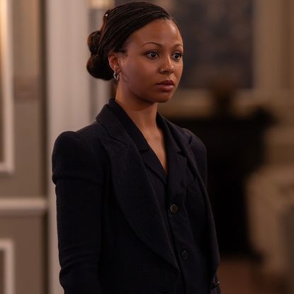 myha'la as harper wearing a black tailor suit looking shocked in a hotel room in industry season 4