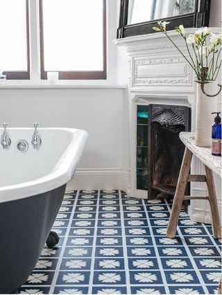 Blue tiles with white border and four cloved pattern
