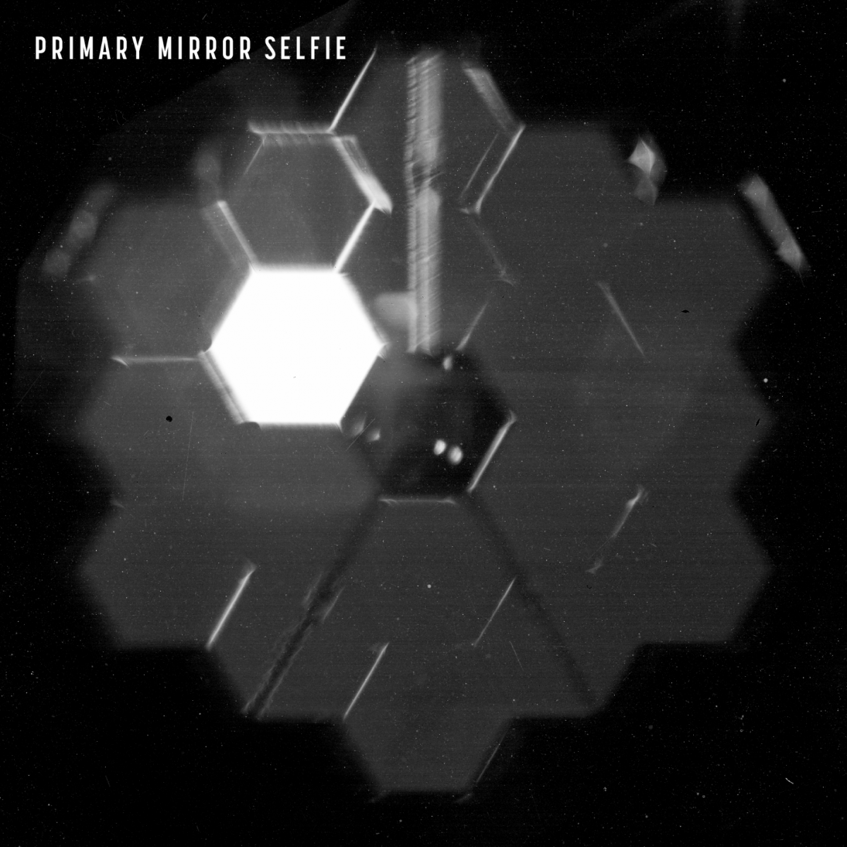 A "selfie" shows the 18 segments of the James Webb Space Telescope's primary mirror as seen from a specialized camera inside the NIRCam instrument.