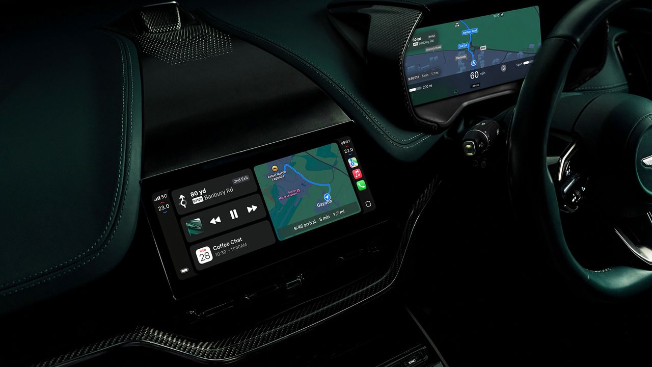 The interior of an Aston Martin car showing Apple CarPlay Ultra