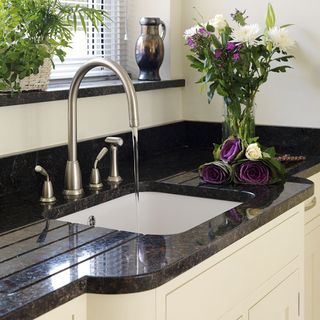 kitchen with white ceramic sink and tap