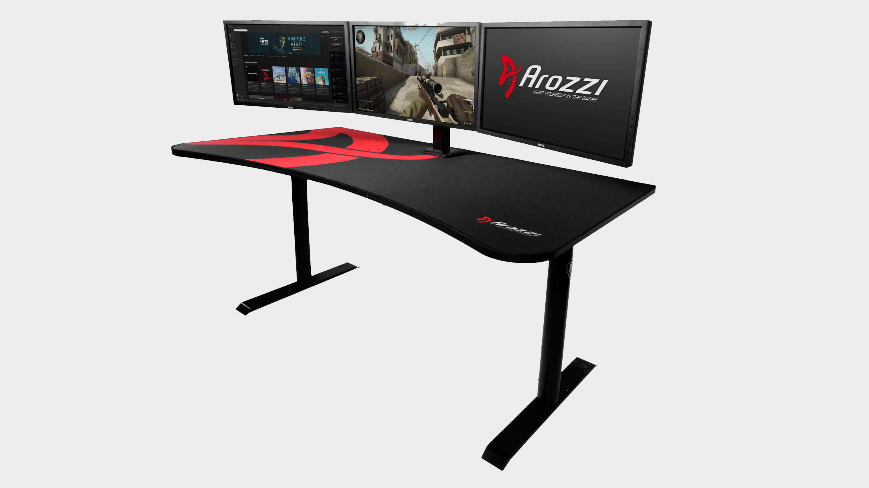 Arozzi Arena gaming desk shot at an angle with a triple monitor setup on the desktop