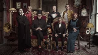 Greg Davies and Alex Horne are flanked by the cast of Taskmaster season 17 in an Edwardian themed promo image