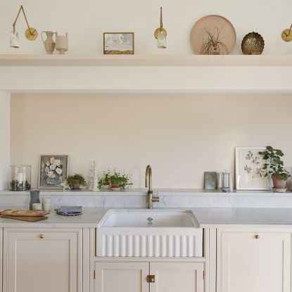 pale pink kitchen with piecrust sink