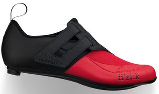A red and black Fizik triathlon shoe on a white background
