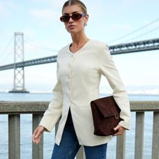 Woman in Old Navy white collarless blazer